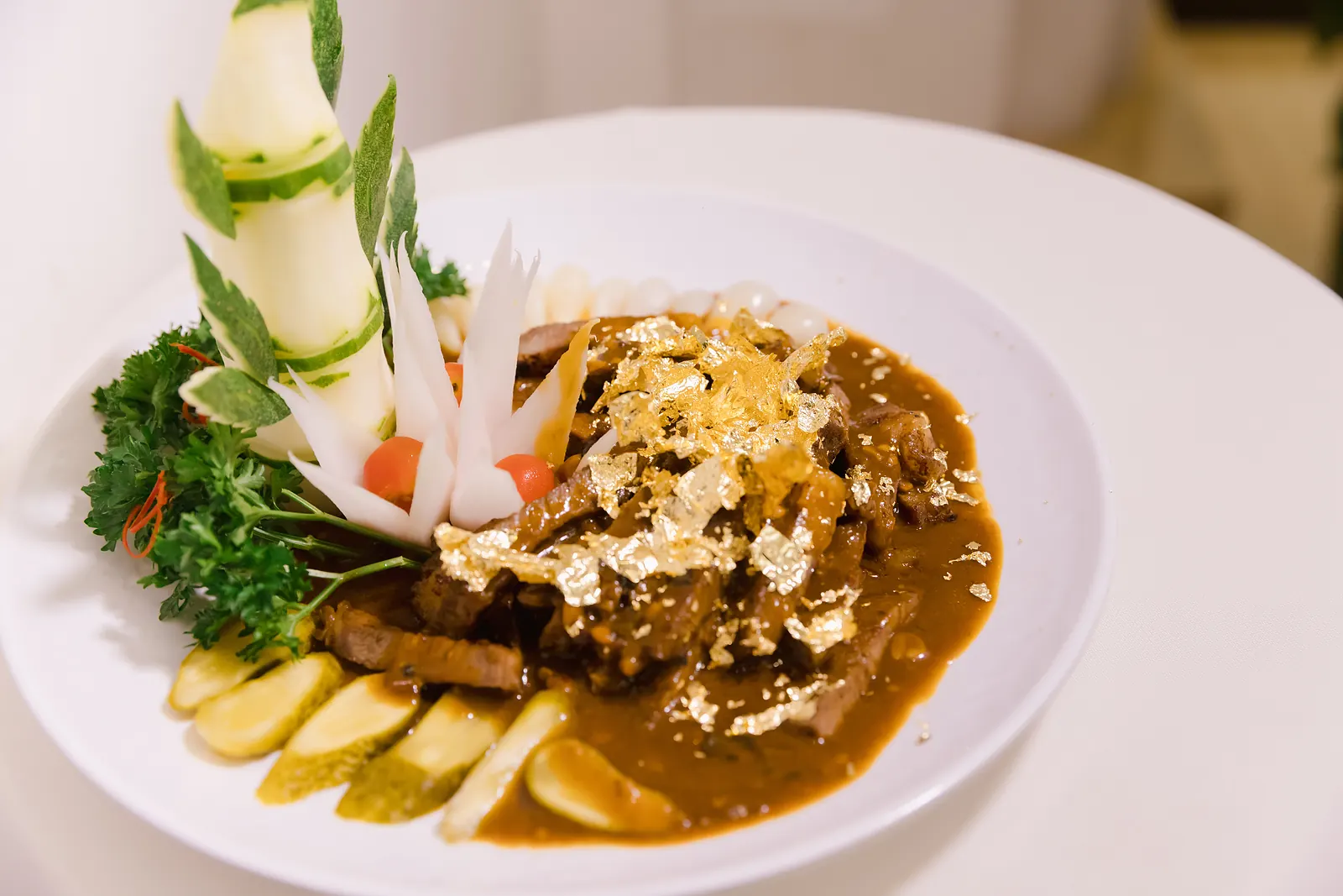 Pan-seared beef with gold leaf